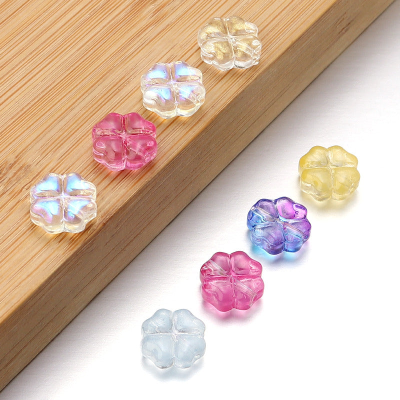 Al por mayor de 50 piezas/paquete de vidrio de color transparente de color trébol de cuatro hojas